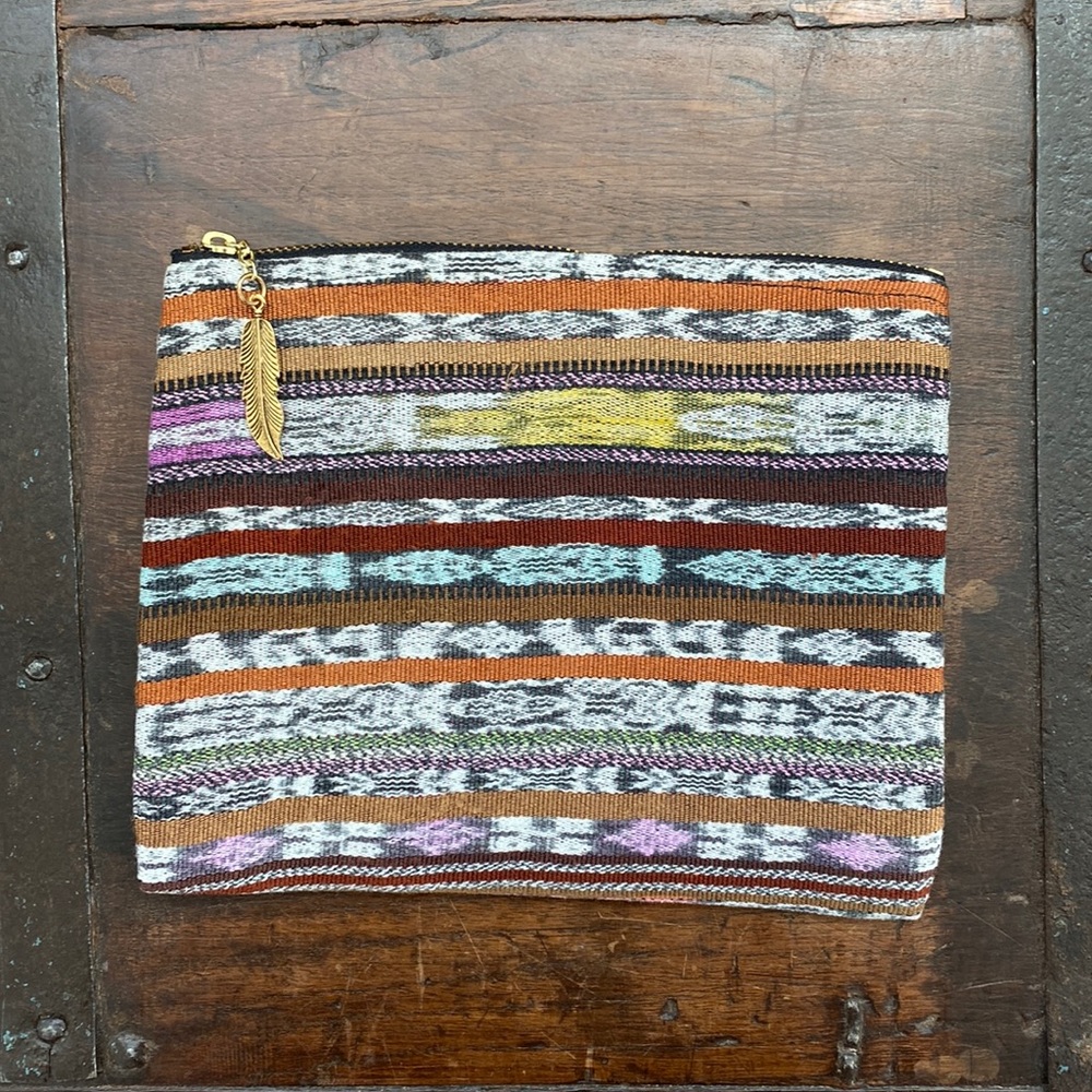 Unique zippered, fully lined, pouch with feather charm pull